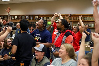 Staff photo by Olivia Ross / Union supporters cheer as they win the election, as they gathered at the International Brotherhood of Electrical Workers on April 19.